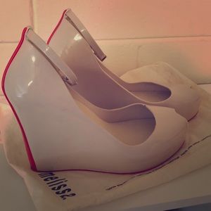 Brand new Nude with a touch of red platform heel